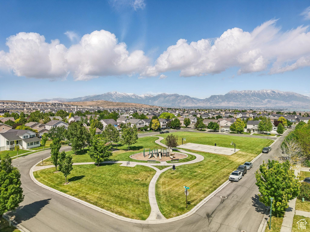 Aerial perspective of suburban area featuring a mountainous background