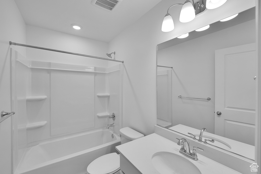 Full bathroom with toilet, vanity, and shower / bathtub combination