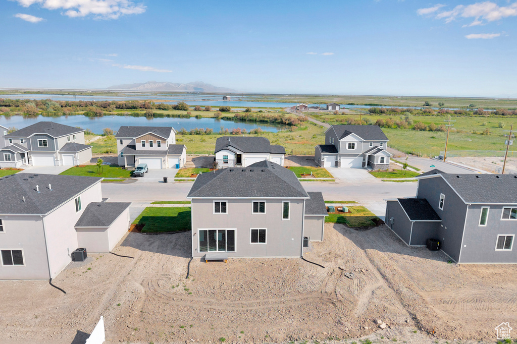 Aerial view of residential area featuring a large body of water