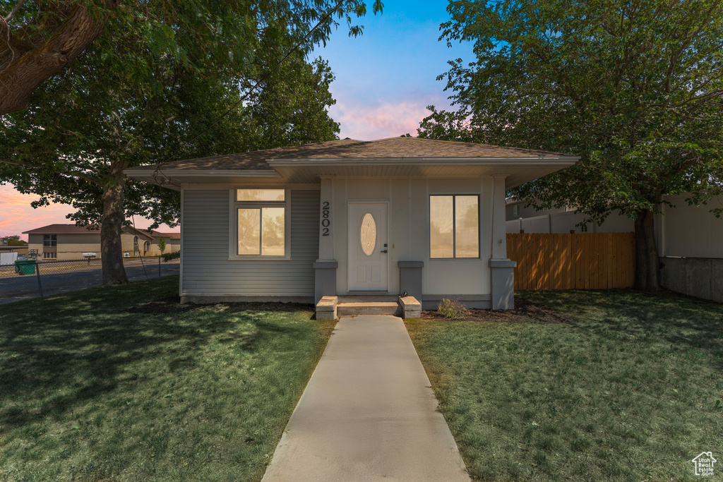 Bungalow-style house featuring a shingled roof