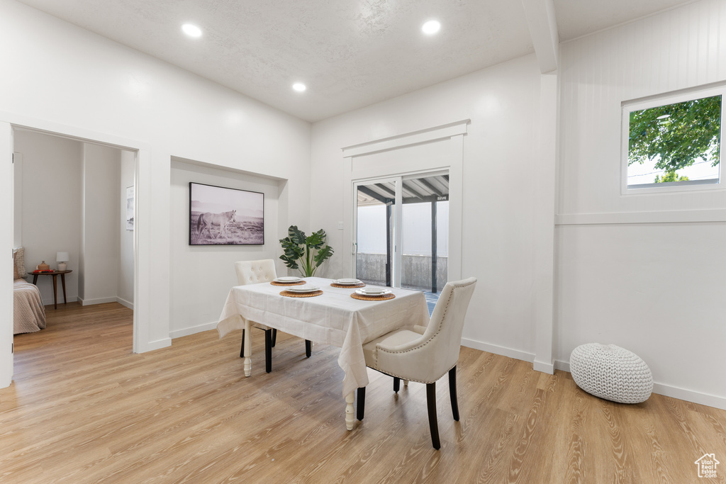 Dining room featuring recessed lighting, light wood-style floors, and baseboards