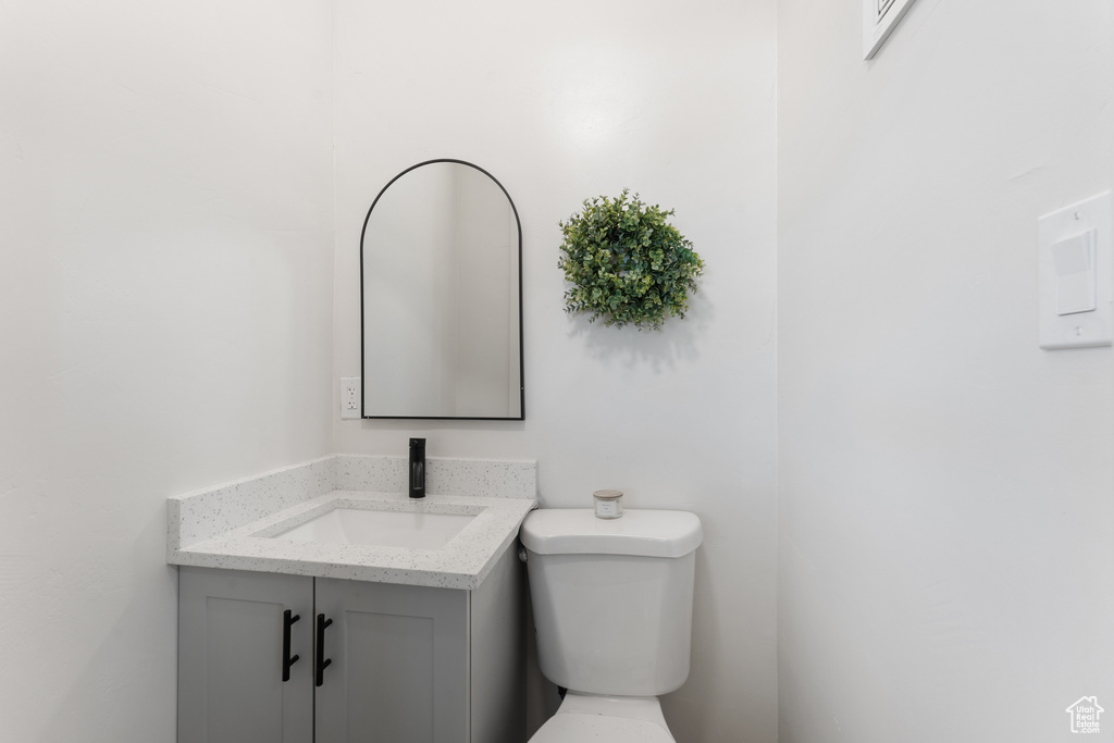 Bathroom featuring vanity and toilet