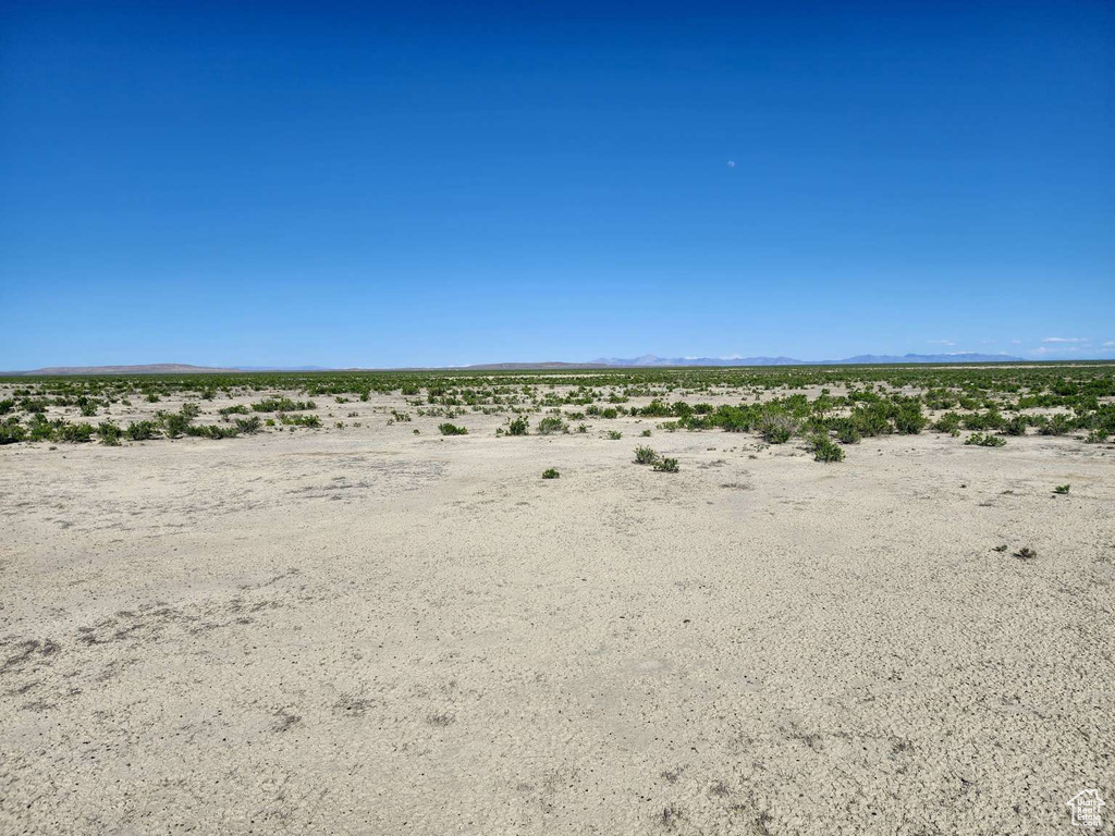 Water view with a desert landscape, rural landscape, and mountains