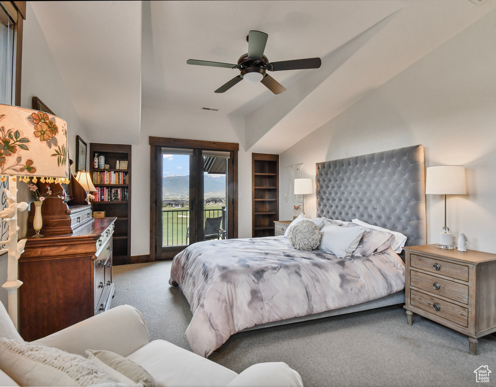 Bedroom with carpet, access to exterior, baseboards, vaulted ceiling, and ceiling fan