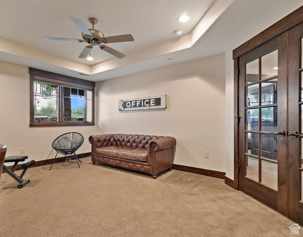 Living area with carpet floors, baseboards, ceiling fan, and recessed lighting