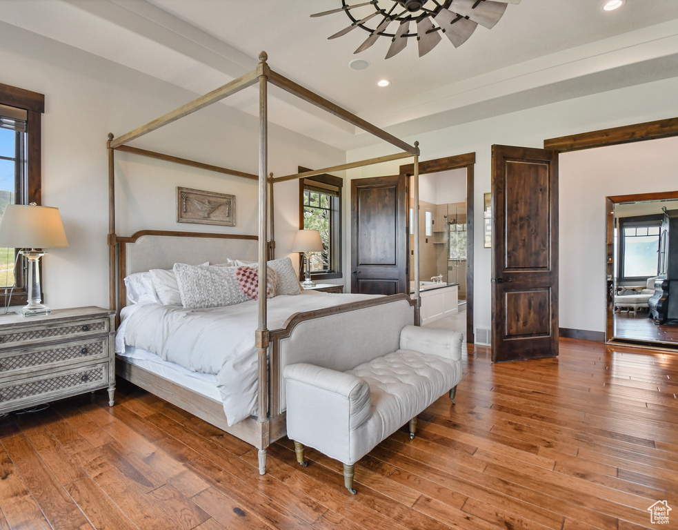 Bedroom featuring recessed lighting, hardwood / wood-style flooring, and baseboards