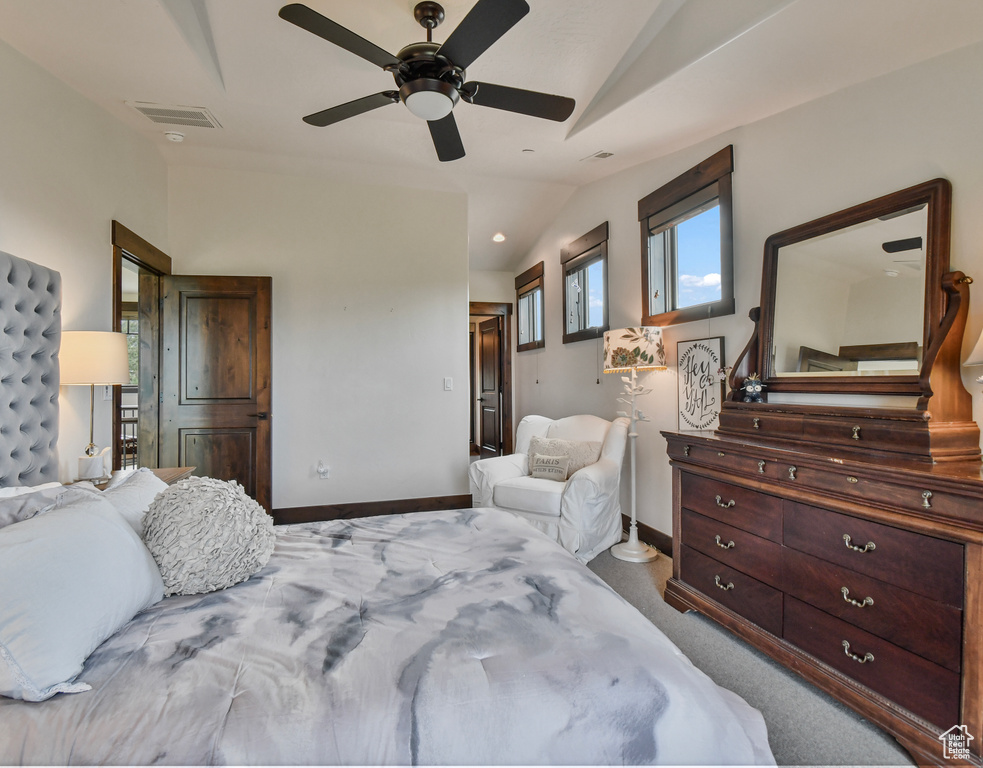 Bedroom featuring lofted ceiling, baseboards, and a ceiling fan