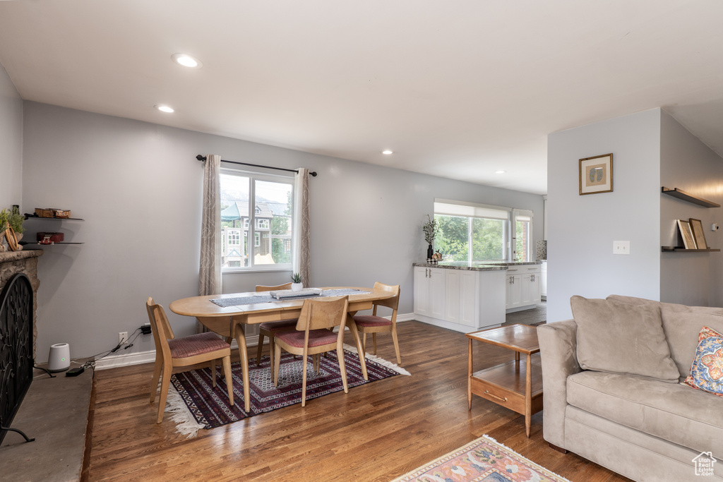 Dining room featuring recessed lighting, wood finished floors, and baseboards