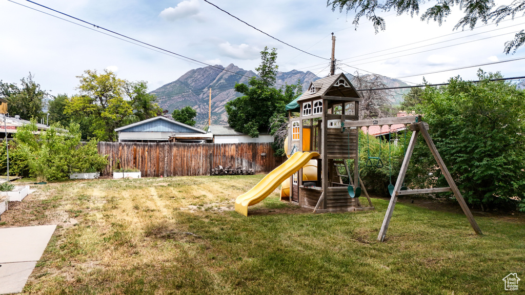 View of jungle gym with a mountain view