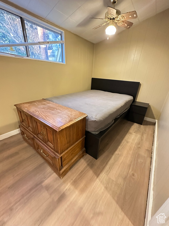 Bedroom featuring wood finished floors and ceiling fan