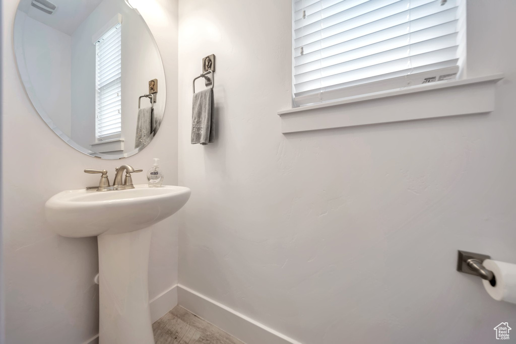 Bathroom with baseboards and a sink