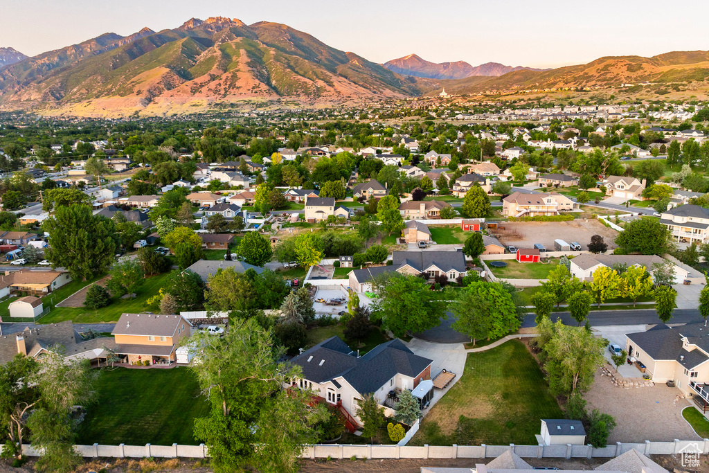 Aerial perspective of suburban area with a mountain backdrop