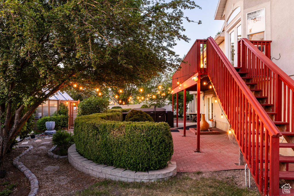 View of yard featuring stairs, a patio, and a deck
