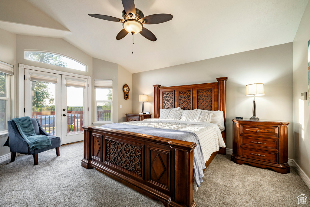 Carpeted bedroom with lofted ceiling, french doors, access to exterior, baseboards, and a ceiling fan