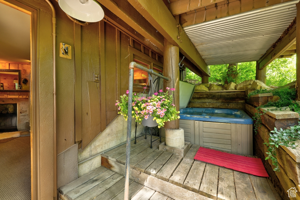 Wooden terrace with a hot tub