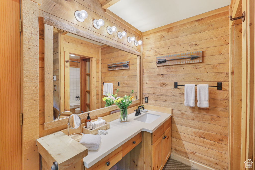 Bathroom with wooden walls and vanity