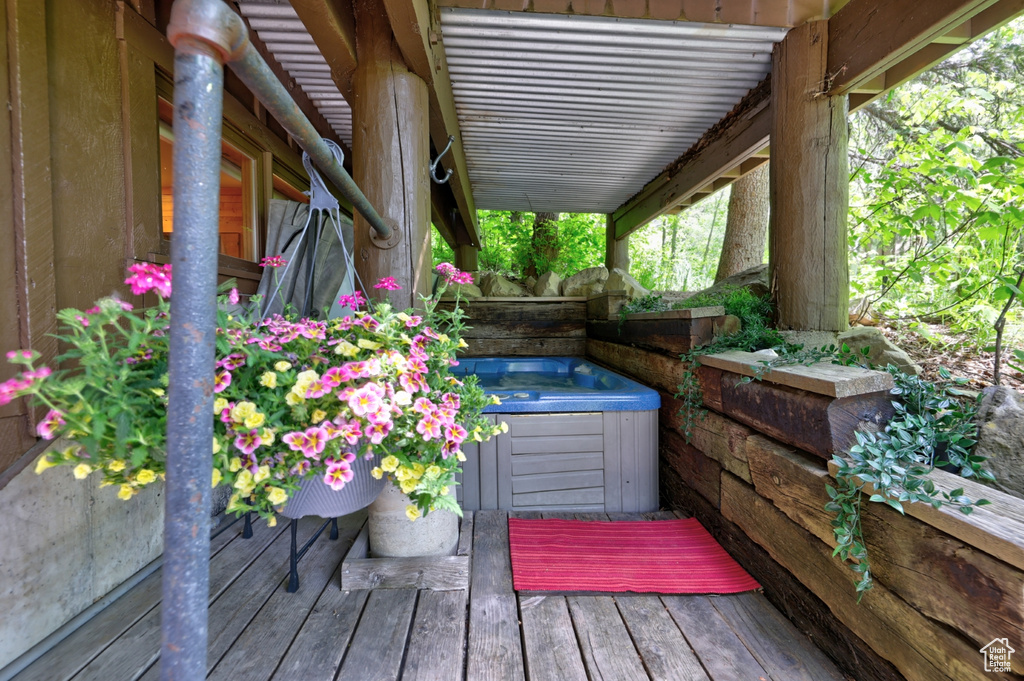 Wooden terrace with a hot tub