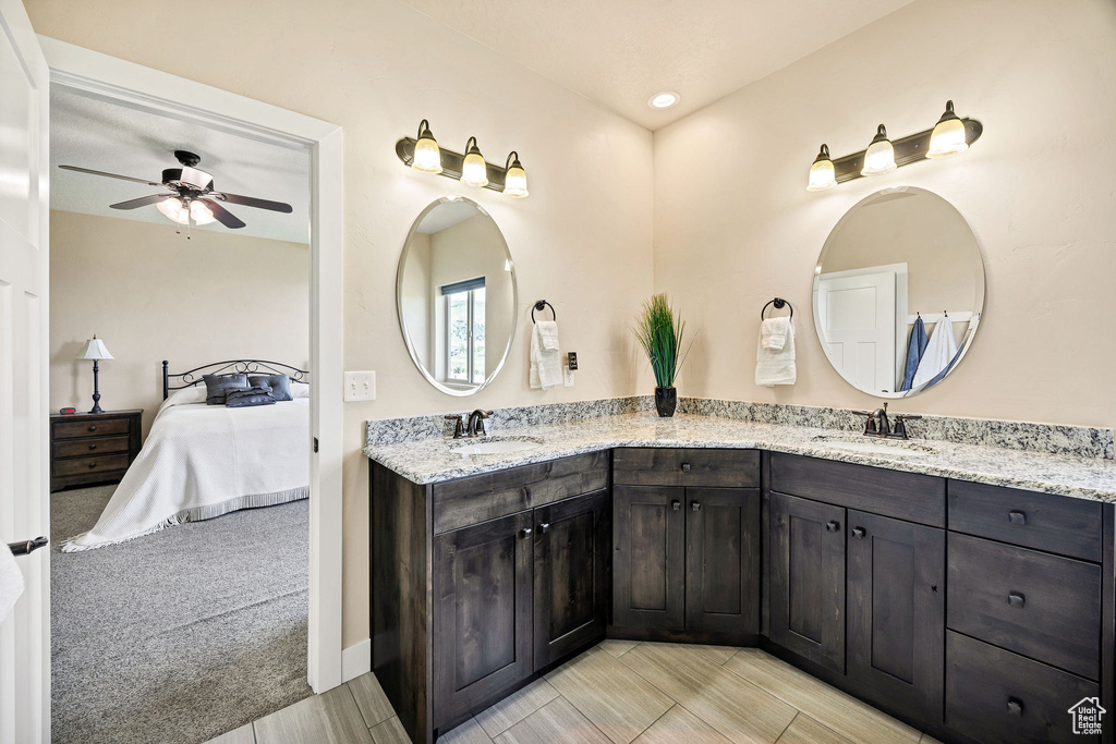 Ensuite bathroom with double vanity, ceiling fan, and recessed lighting