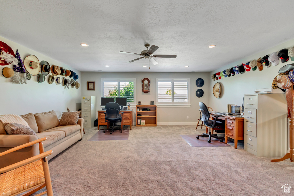 Office area with light colored carpet, a ceiling fan, recessed lighting, baseboards, and a textured ceiling