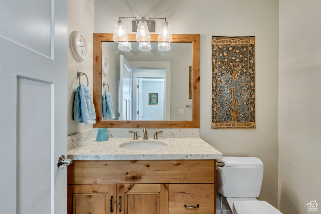 Half bath with vanity and toilet
