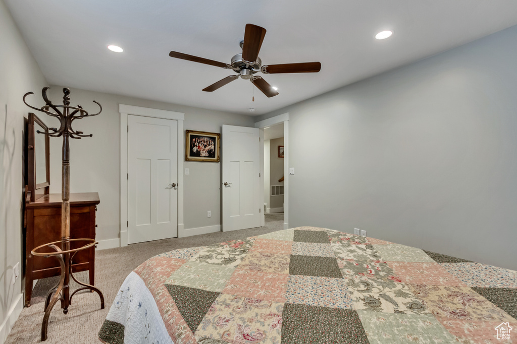 Bedroom featuring recessed lighting, baseboards, light carpet, and a ceiling fan