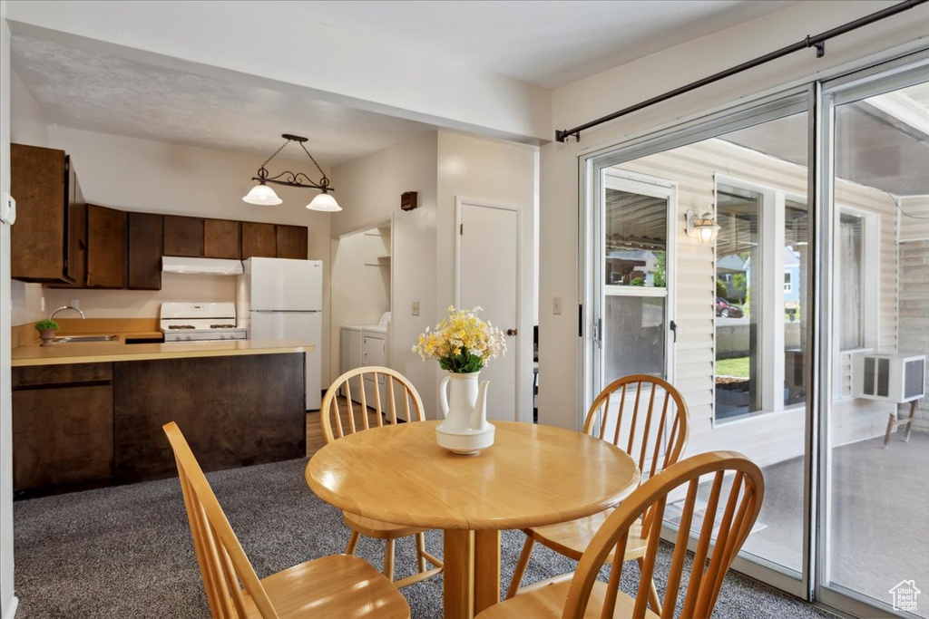 Dining room featuring washer and clothes dryer