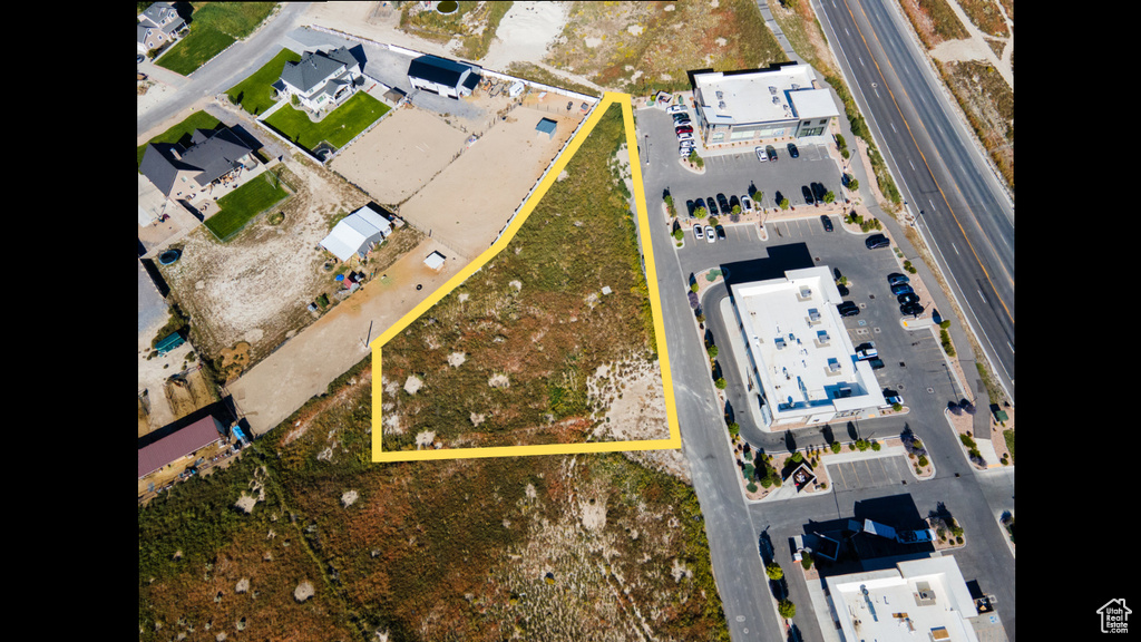 Aerial view of property\'s location with property parcel outlined