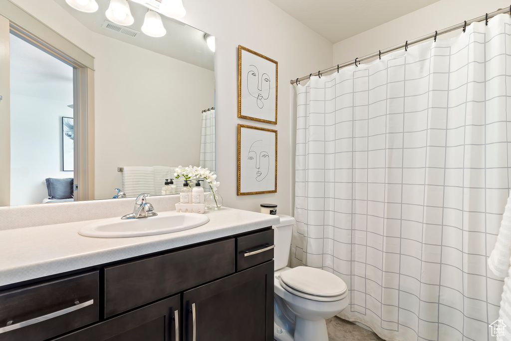 Bathroom featuring toilet and vanity