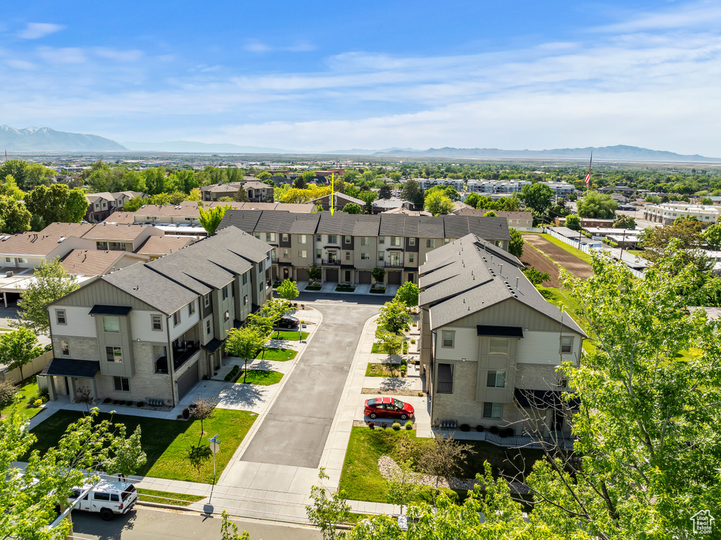 Aerial view of residential area featuring mountains