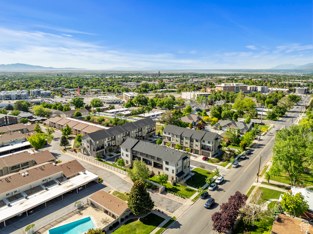 Aerial view of a mountain backdrop and a pool