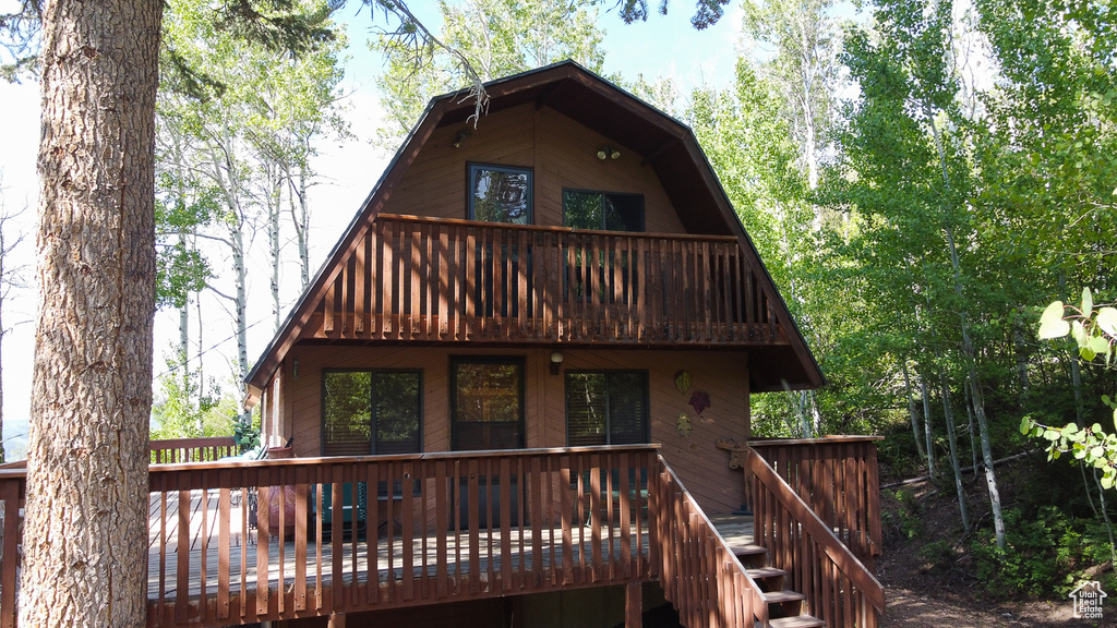 Back of house featuring a deck