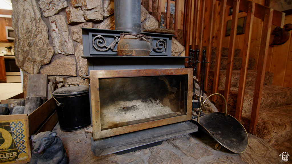 Detailed view of white appliances and a wood stove