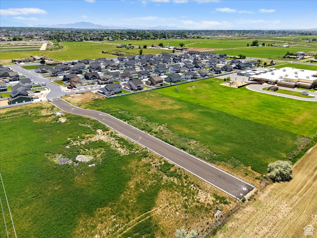 Aerial view of residential area featuring mountains