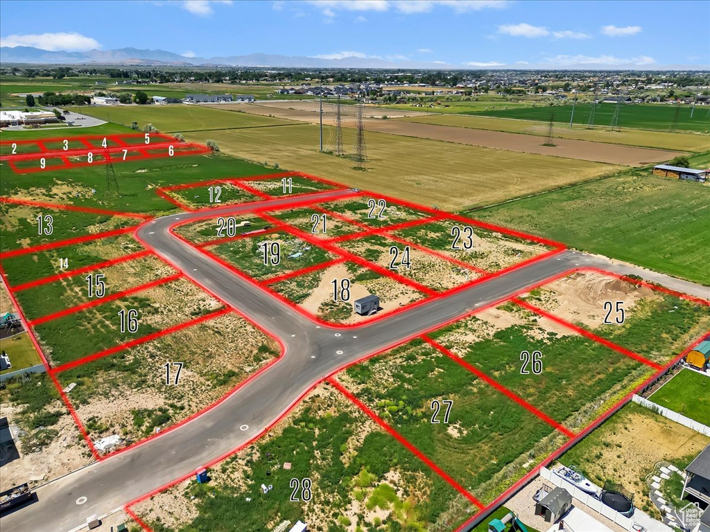 Aerial overview of property's location with property boundaries highlighted and mountains