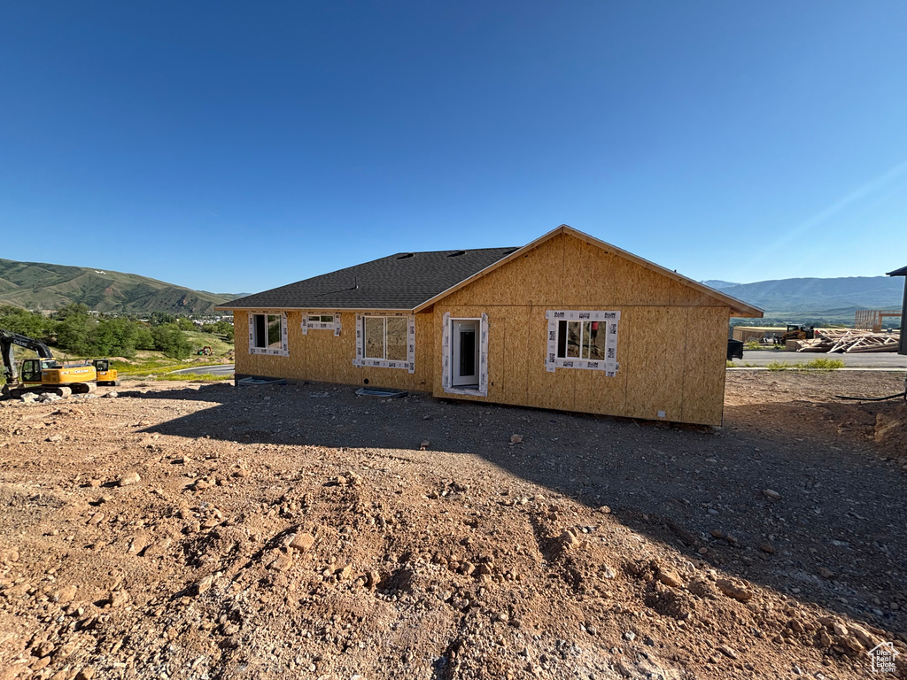Rear view of house with a mountain view