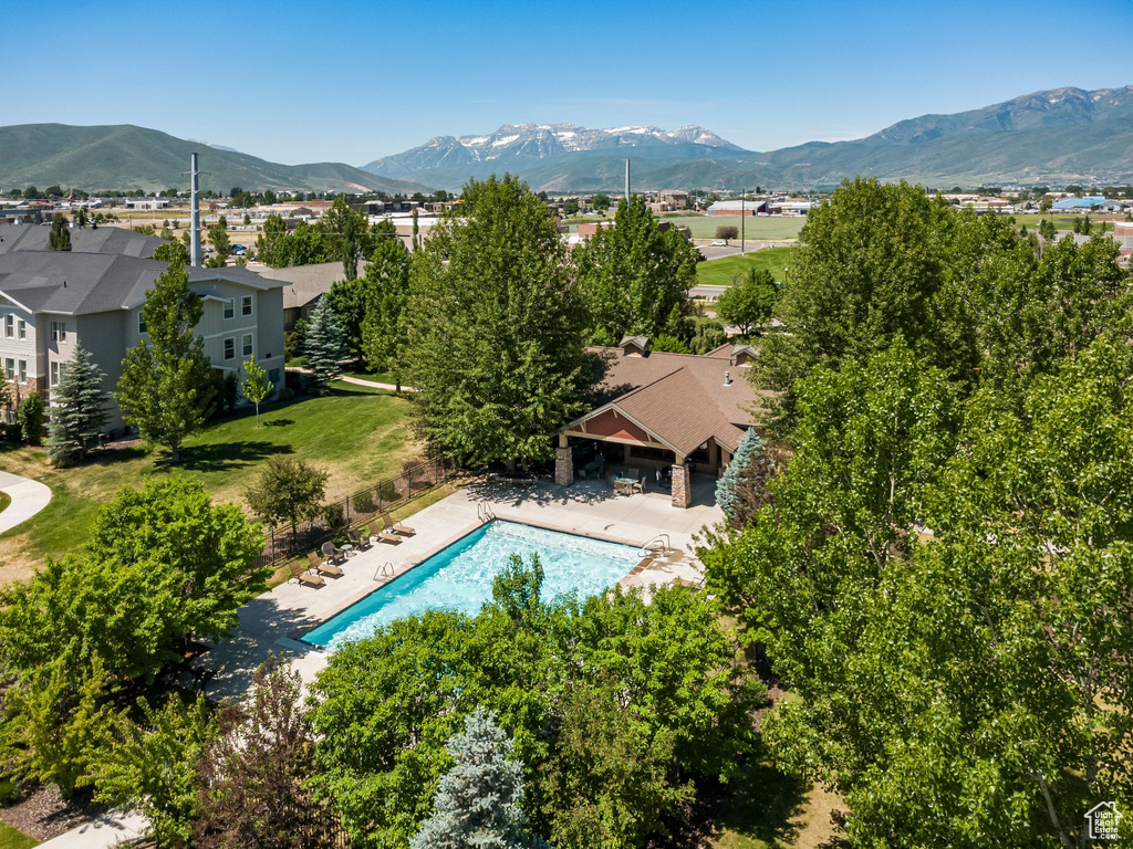 Aerial view of a mountain backdrop and a pool
