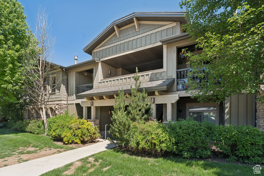 View of building exterior featuring a garage