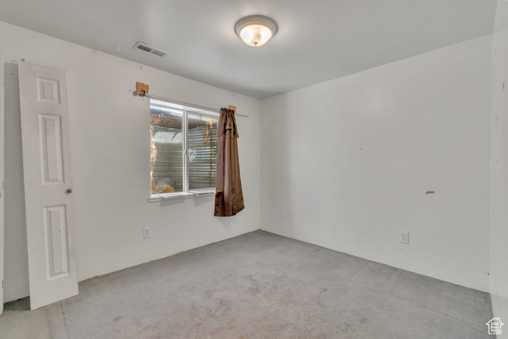 Spare room with carpet floors
