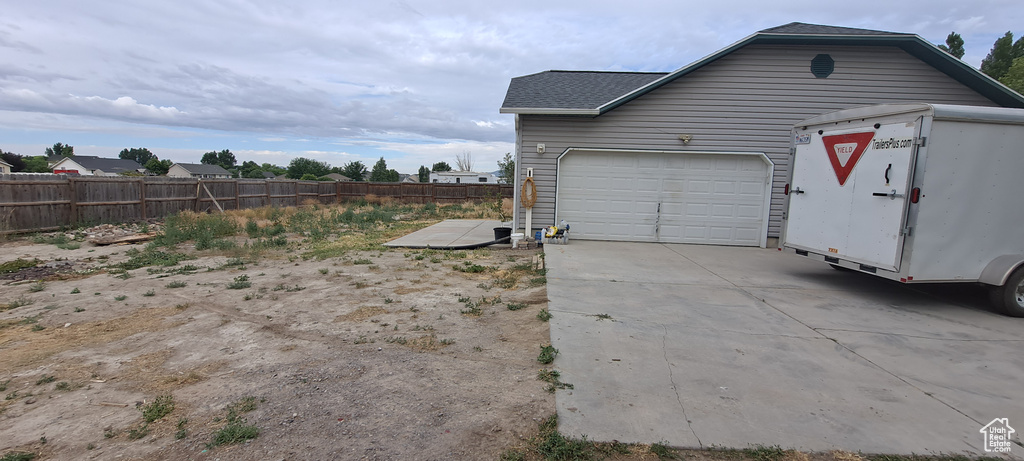 Garage with concrete driveway