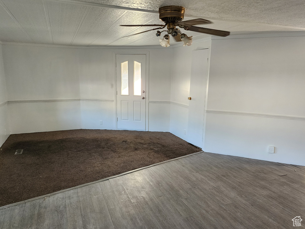 Unfurnished room with ceiling fan and wood finished floors