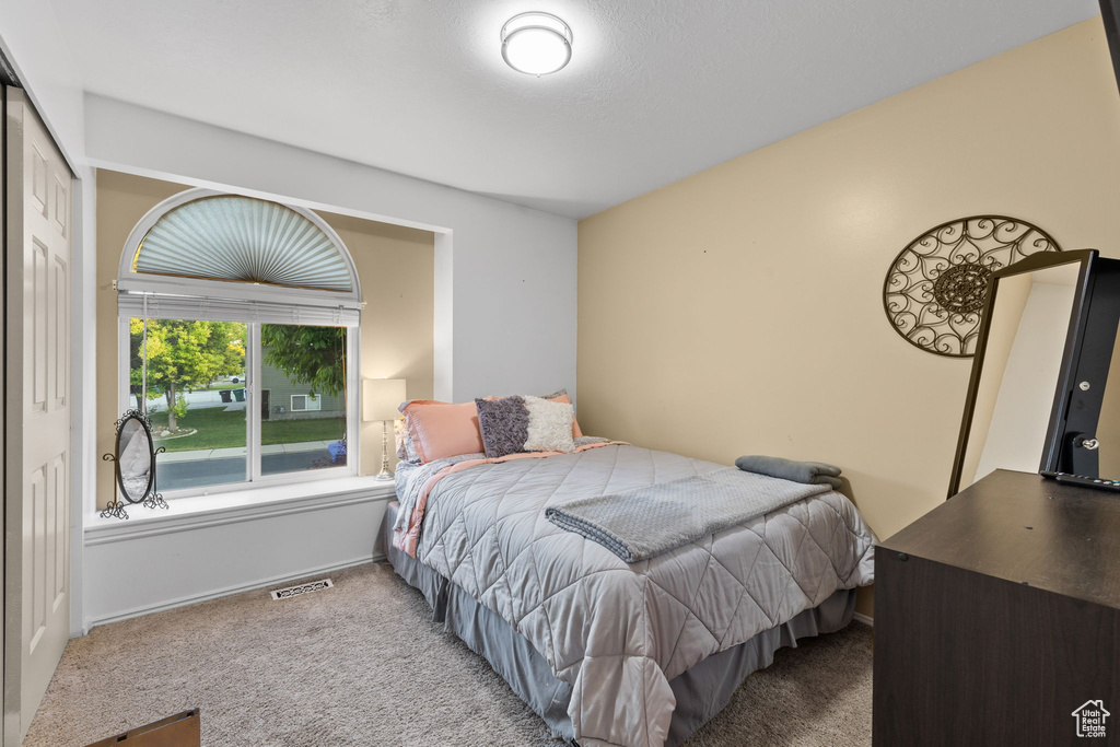 Bedroom with carpet and baseboards