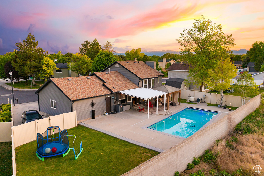 View of swimming pool with a patio and a residential view