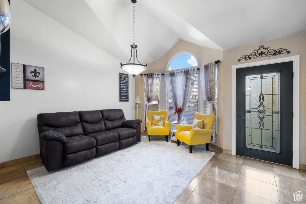 Living area with high vaulted ceiling