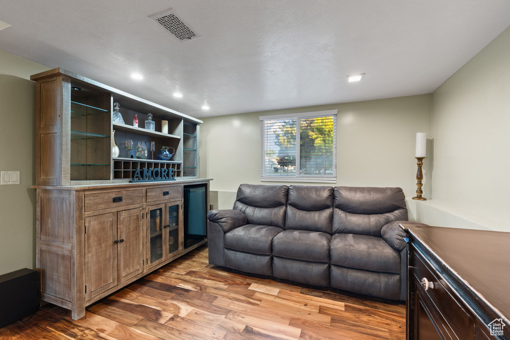 Living room featuring wood finished floors and recessed lighting