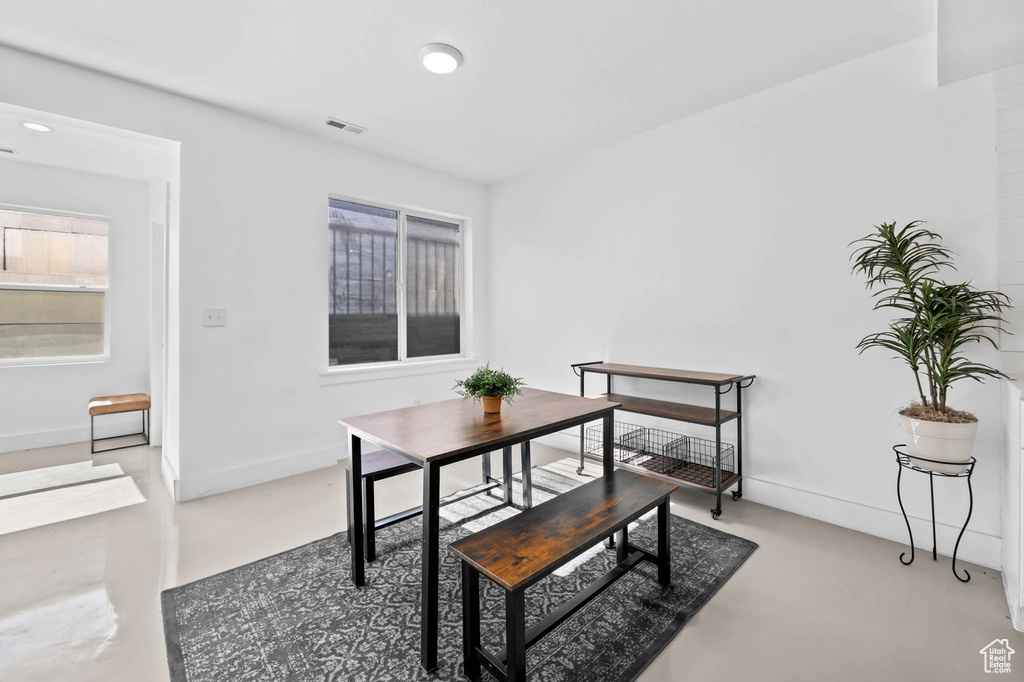 Dining area with concrete flooring