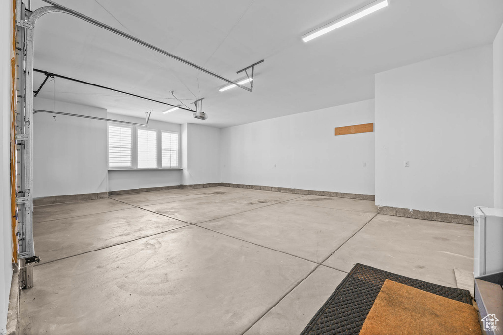 Garage featuring baseboards