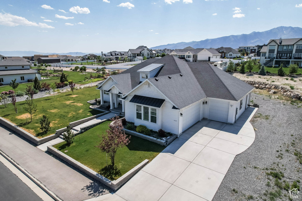 Aerial perspective of suburban area with a mountainous background