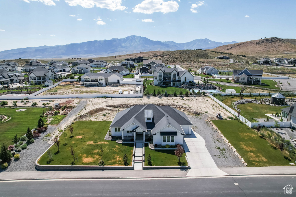 Aerial view of residential area featuring a mountain backdrop
