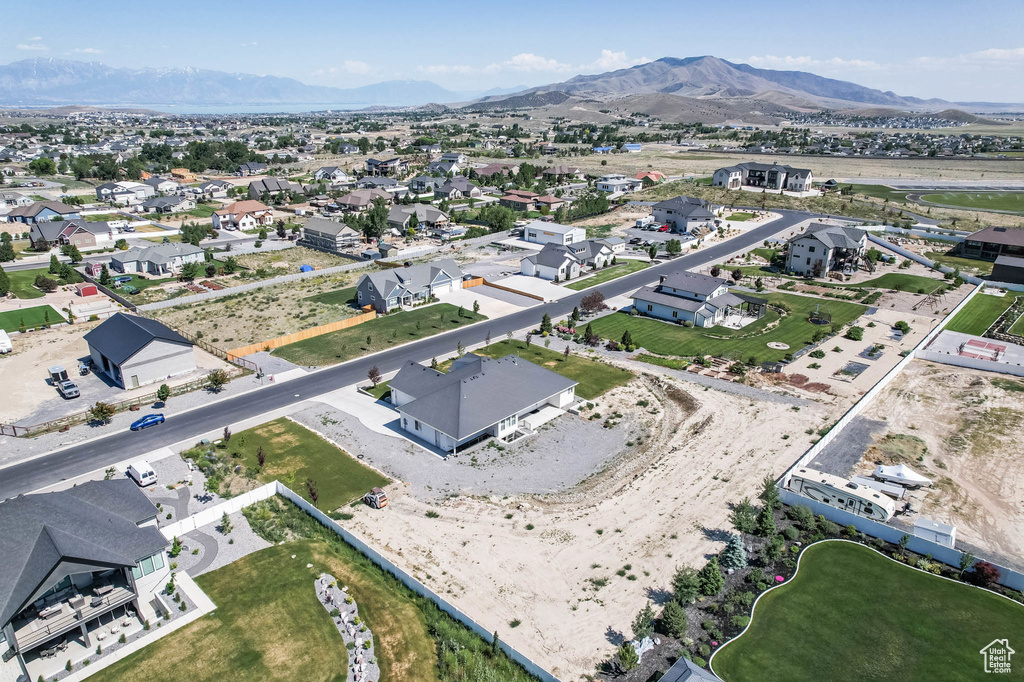 Aerial perspective of suburban area with a mountain backdrop