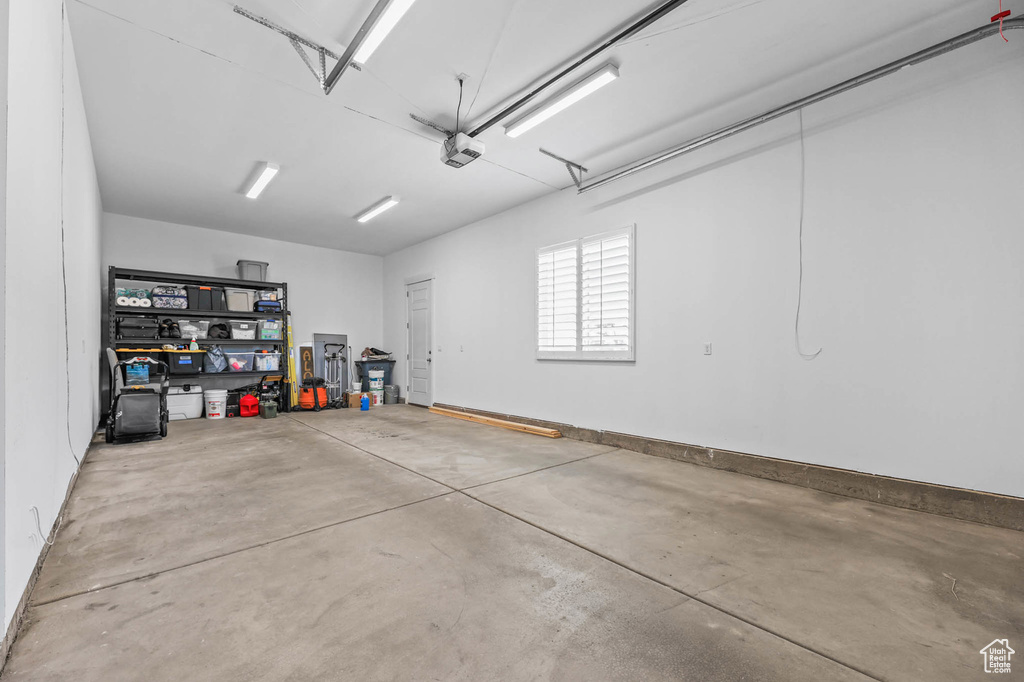 Garage featuring a garage door opener